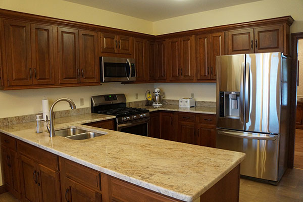 Kashmir Cream on walnut-stained cabinets